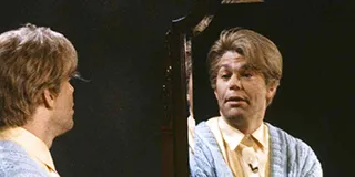 Stuart Smalley from SNL talking to himself in the mirror practicing self-affirmation
